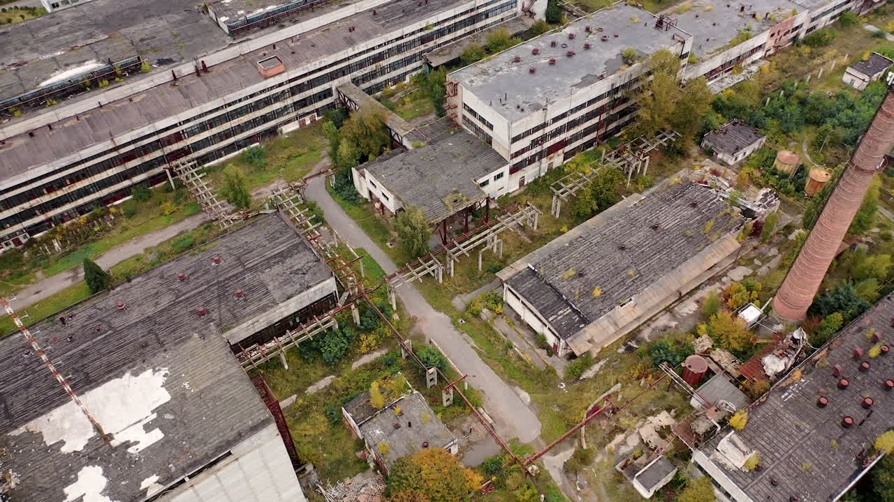Abandoned ruined factory building architecture. Industrial destroyed city buildings.