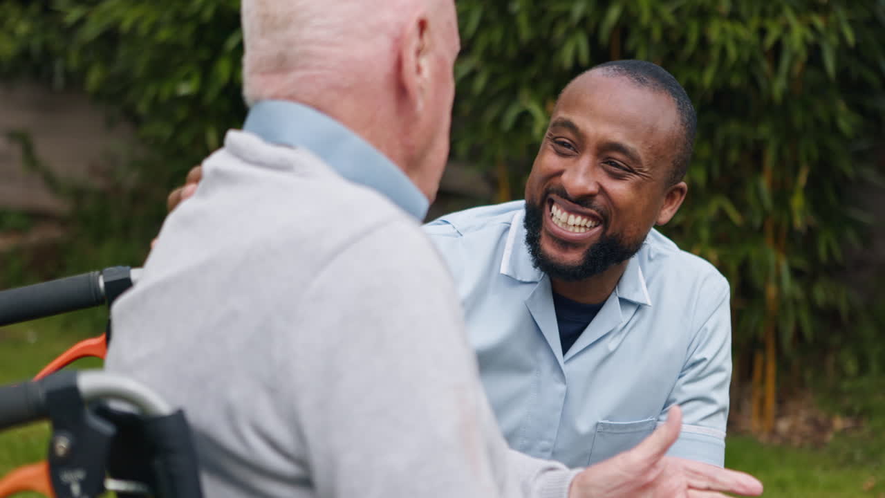 Caregiver assisting senior man in garden