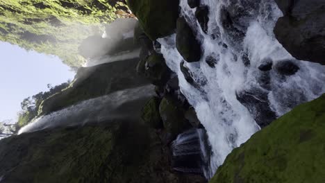 panoramic video shot of three waterfalls falling into the riverbed in the middle of the tropical jungle of costa rica