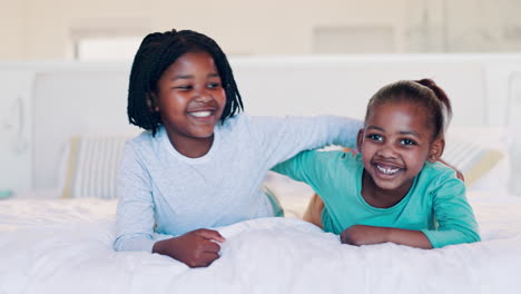 children, siblings and face on bed in home