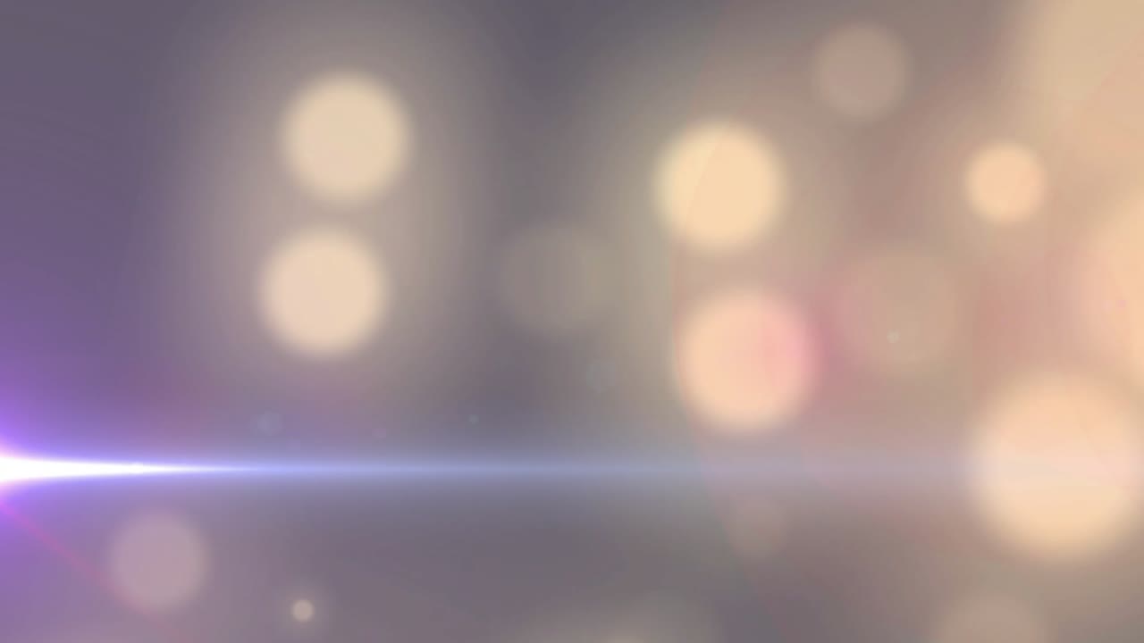 Bokeh orbs drifting on grey initiating orbs emerging right and bright streak pulsing for balance