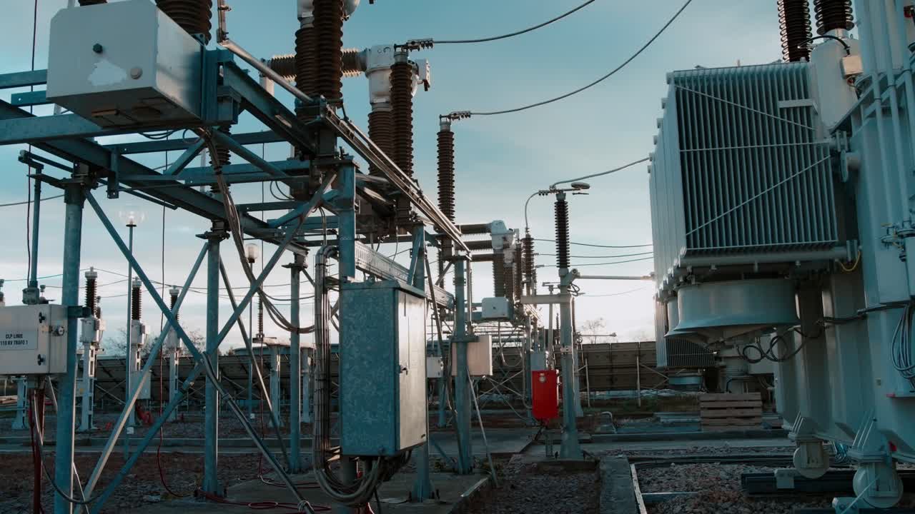 Outdoor power station with transformers under clear sky