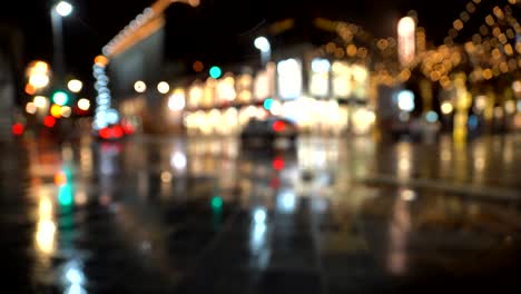 Out-of-focus-footage-of-car-and-pedestrian-traffic-at-night-in-Denver-Downtown