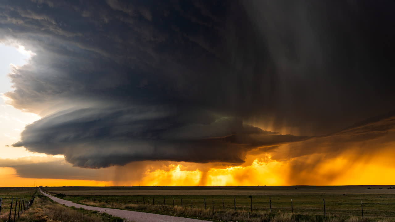 Supercell thunderstorm powerful nature dangerous weather with colorful sunset