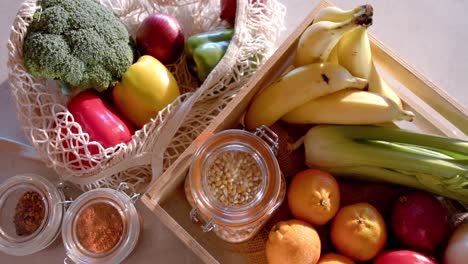 overhead view of vegetables in sunny kitchen, in slow motion