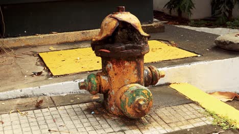 4k footage of an old and abandoned fire hydrant in the streets of panama