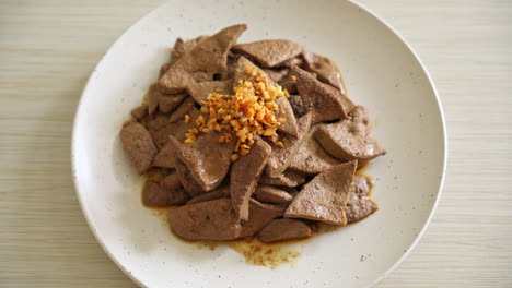 homemade stir-fried pork liver with garlic on plate