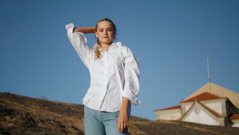 sensual lady posing sky background closeup. relaxed model enjoying castle place