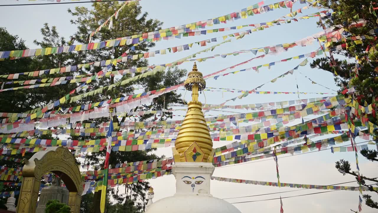 Buddhist Temple and Prayer Flags at Monkey Temple in Kathmandu in Nepal, Beautiful Architecture and Colorful Buddhist Prayer Flags of Bright Colors at the Sacred Holy Religious Site for Buddhism