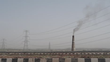 smoke and air pollution from a chimney of a brick factory