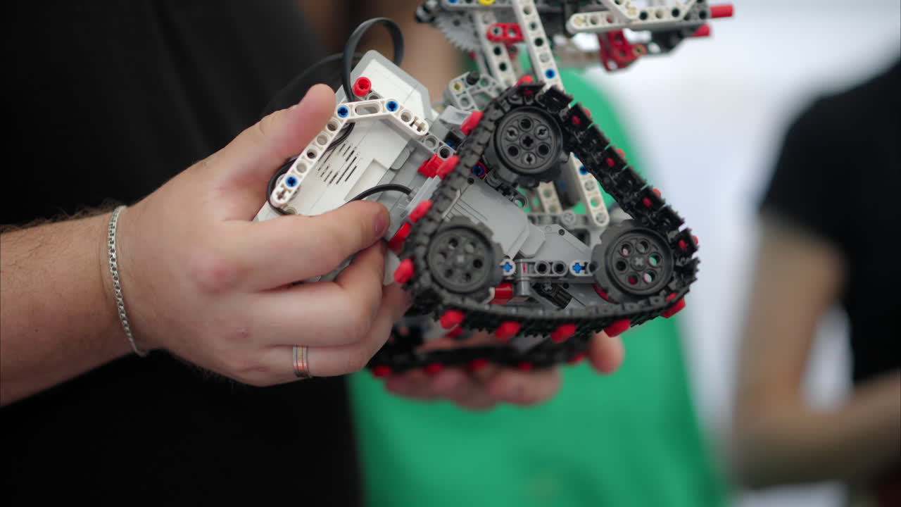 Man analysing a moving robot, slow motion