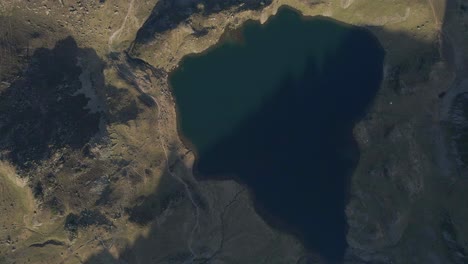 top-down drone footage of the gento lake in the ayous lakes at the pyrenees mountains