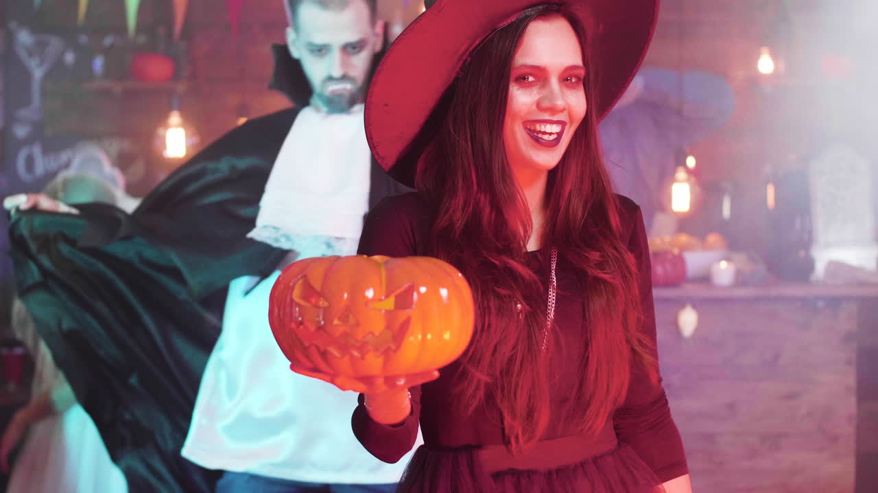 Halloween party with witch and pumpkin