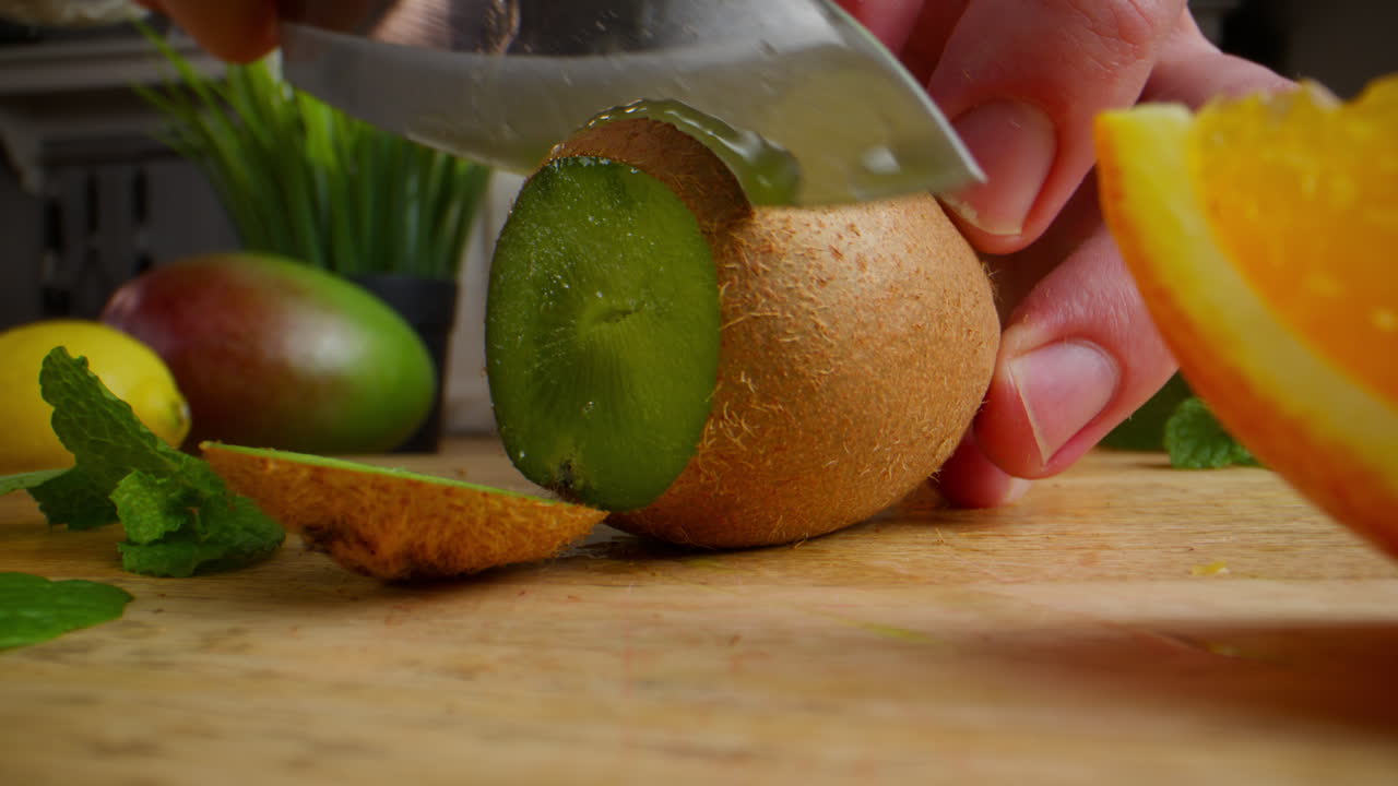 Cutting Kiwi and Orange