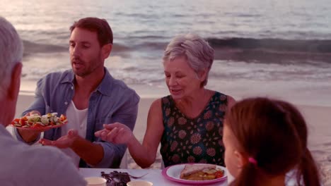happy extended family eating