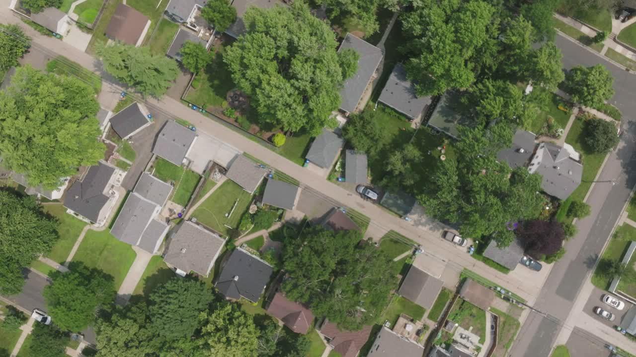 Aerial View of a Suburban Neighborhood with Houses and Green Trees