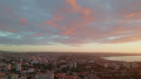 panoramic view coastal city under picturesque golden sunset. orange sundown