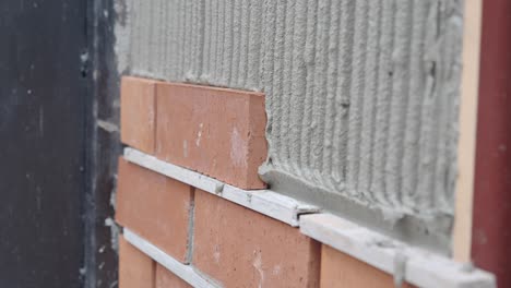 close up of a bricklayer laying bricks