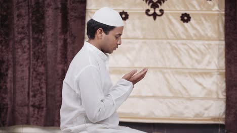 indian muslim man reading namaz at home to allah