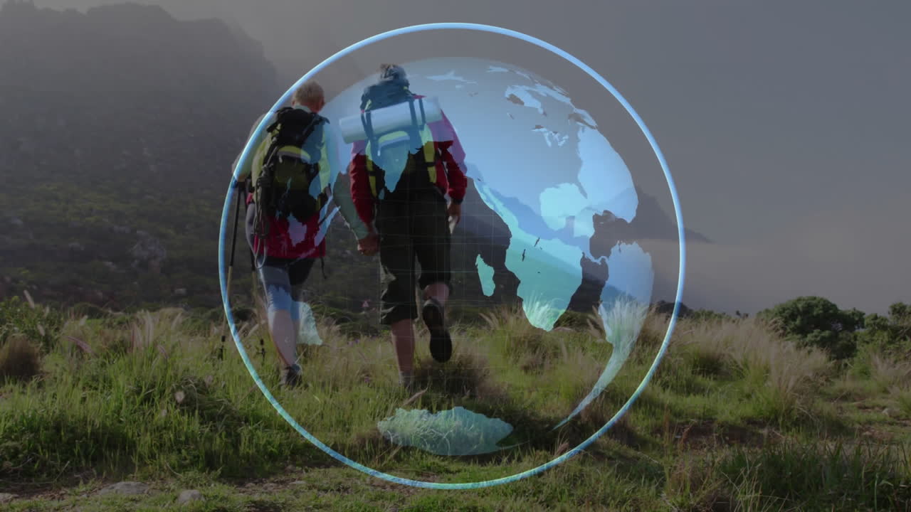 Couple hiking uphill in mountain meadow, showcasing digital globe overlay for tech presentation