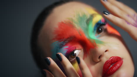 close up portrait beautiful woman wearing colorful face paint dancing exotic multicolored body art with light flashing