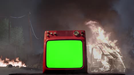 a street riot and old television with green screen. 4k.