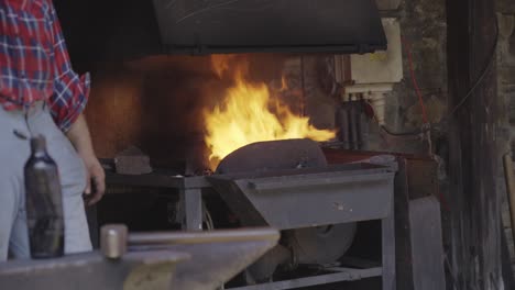 blacksmith working at the forge