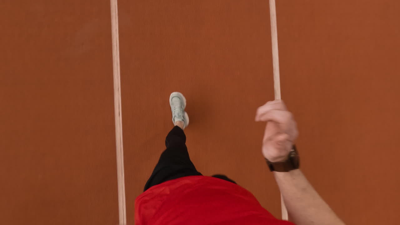 First Person View of a Person Running on a Track