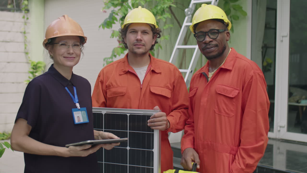 Portrait of Female Engineer and Workers with Solar Panel Outdoors