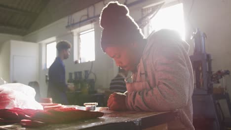 mixed race man working in factory