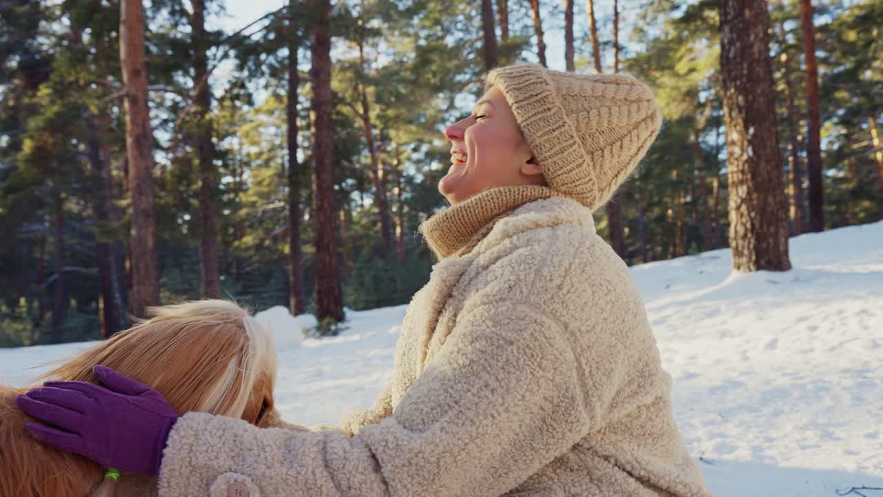Woman and her Dog in a Snowy Forest