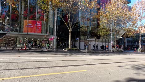 tram and people on swanston street, melbourne