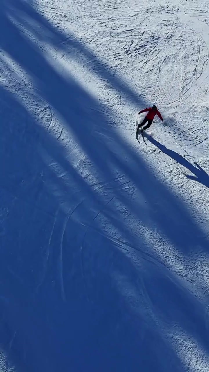 Snowboarder rides the slopes in the Carpathian mountains in Bulgaria