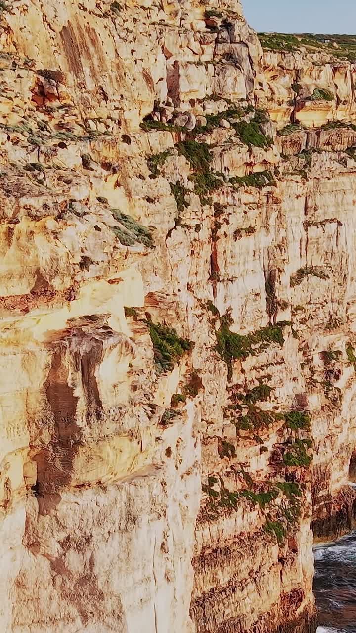 Explore Malta's cliffs and coastline near the water during sunset hours