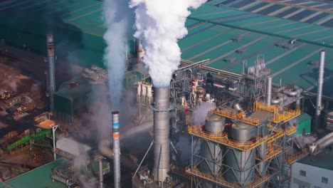 smoke coming out from chimney of industrial plant