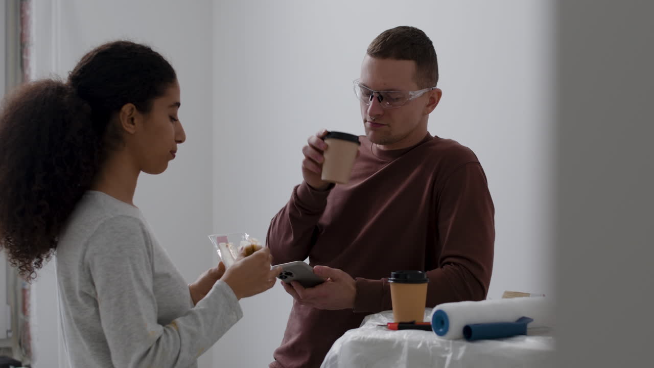 Young Couple Taking a Break During Home Renovation