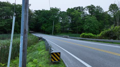 Still-look-at-a-rural-street-across-a-marsh