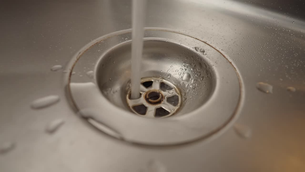 Water flowing down a sink drain