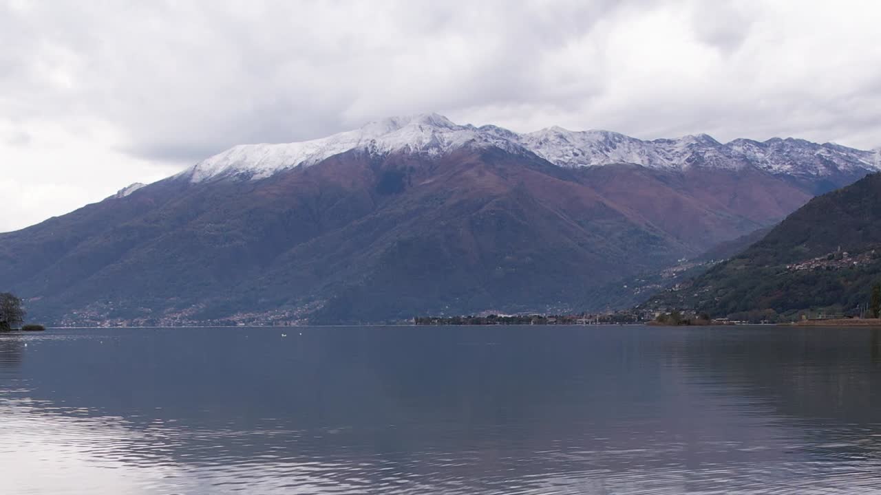 Stunning aerial view of the Italian Alps with a serene lake