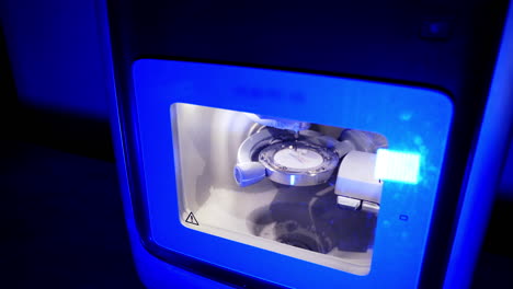 advanced automated dental milling machine. dental milling machine carving out shape of human teeth