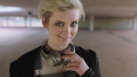 portrait-of-smiling-trendy-woman-student-wearing-headphones-happy-alternative