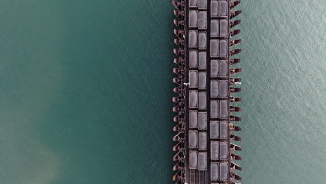 drone shot looking straight down on mining cars full of iron ore