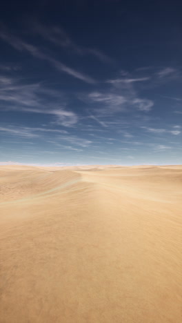 a vast desert landscape with blue sky and white clouds