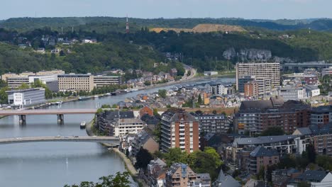 a timelapse of the city of namur in belgium in the month of july, a lot of car passage and boat builders in motion