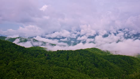 cinematic flight over the misty mountain ridges.