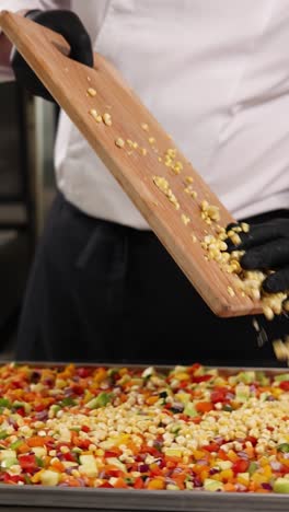 chef preparing mixed vegetable dish with corn