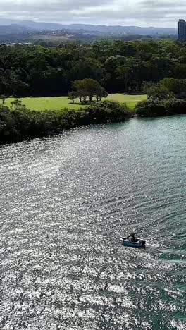 boat creating circular patterns on the river