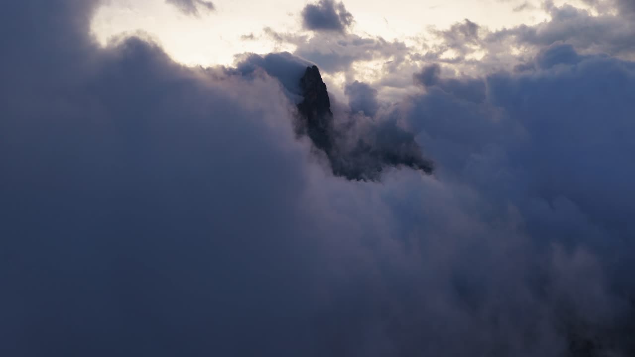 Pale di San Martino Massif Covered In Clouds In Dolomites, Trentino, Italy. - aerial shot