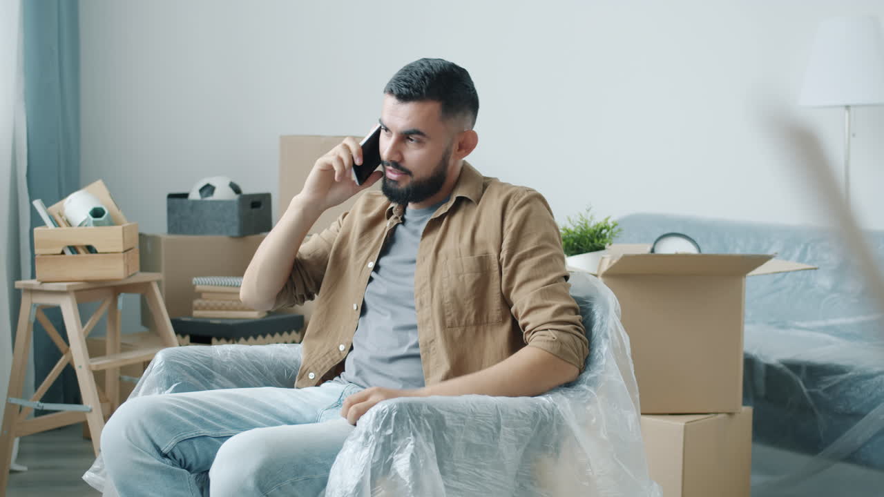 Man on the phone during a move