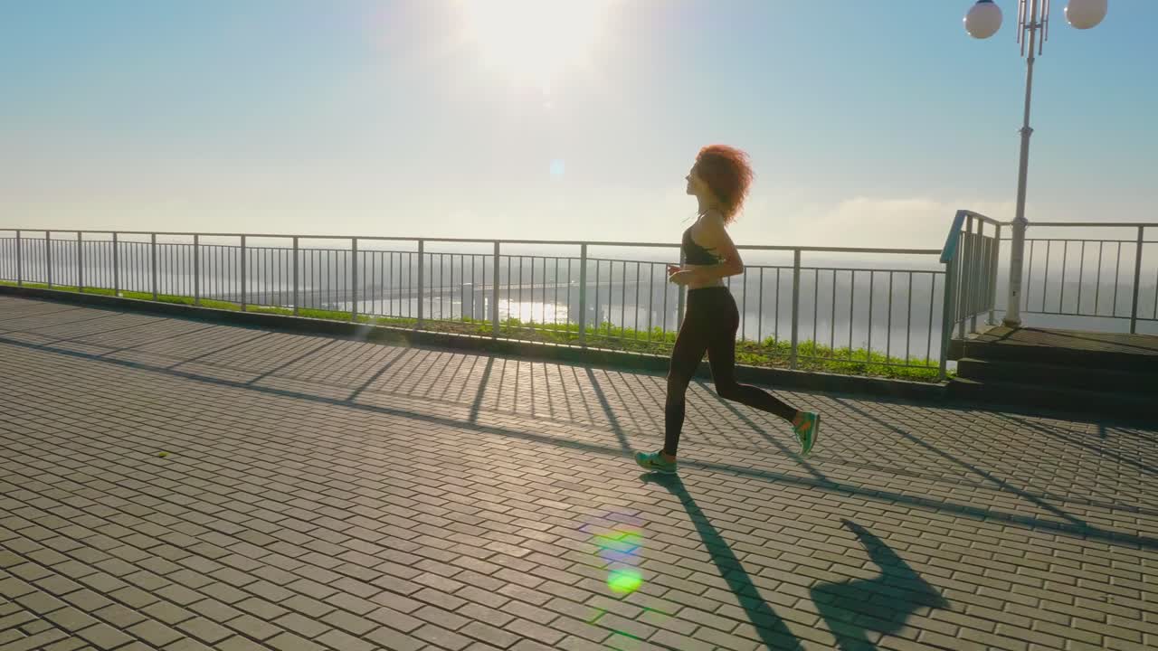 Woman Running Outdoors at Sunrise